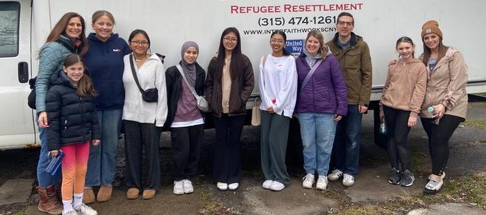 Building bridges and bedding: CNS students partner with InterFaith Works to welcome New Americans