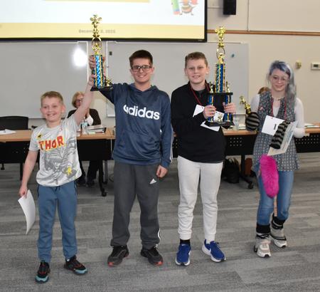 NSCSD spelling bee winners with trophies